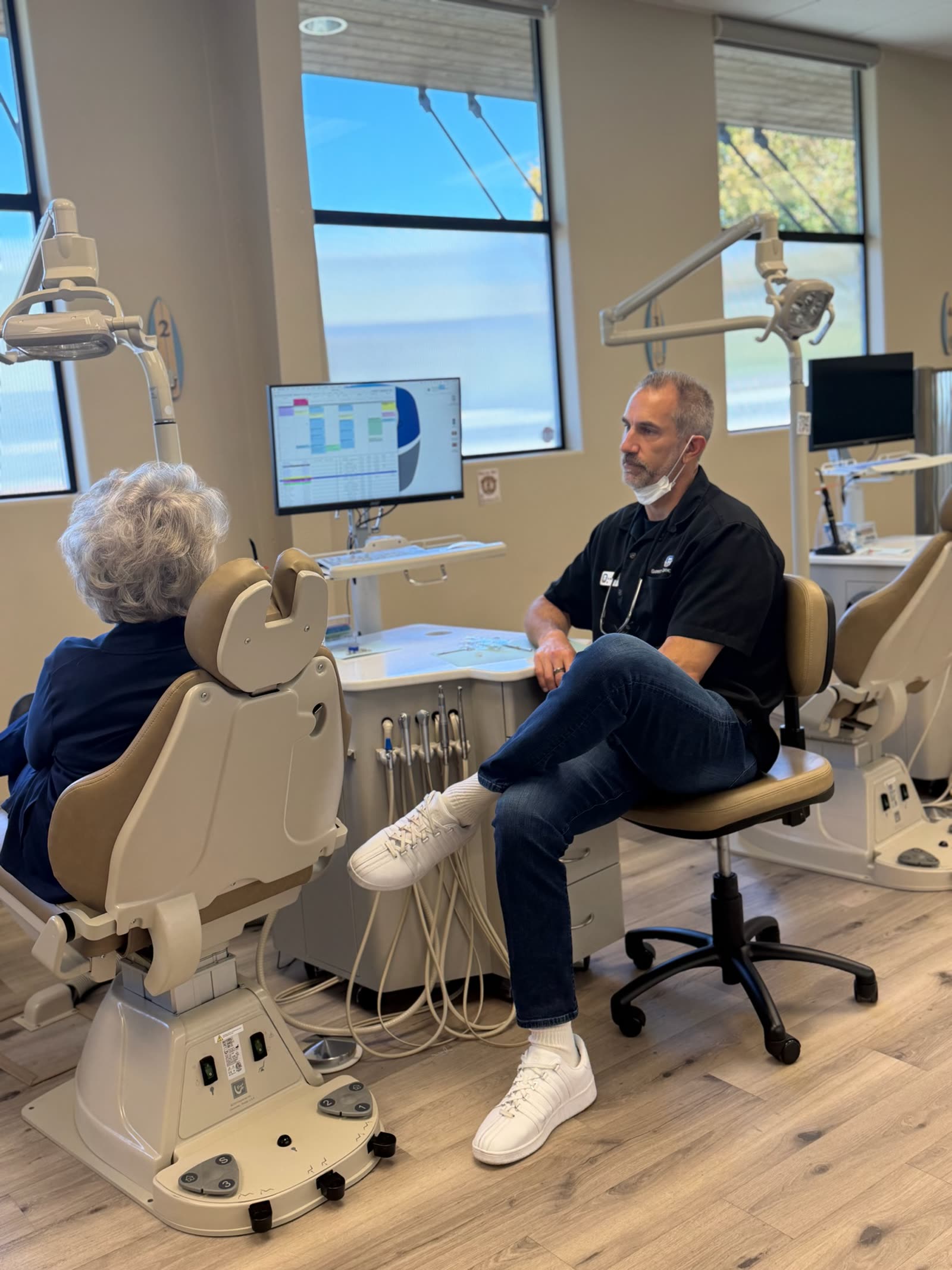 Dr. Garrett talking a patient through her treatment.