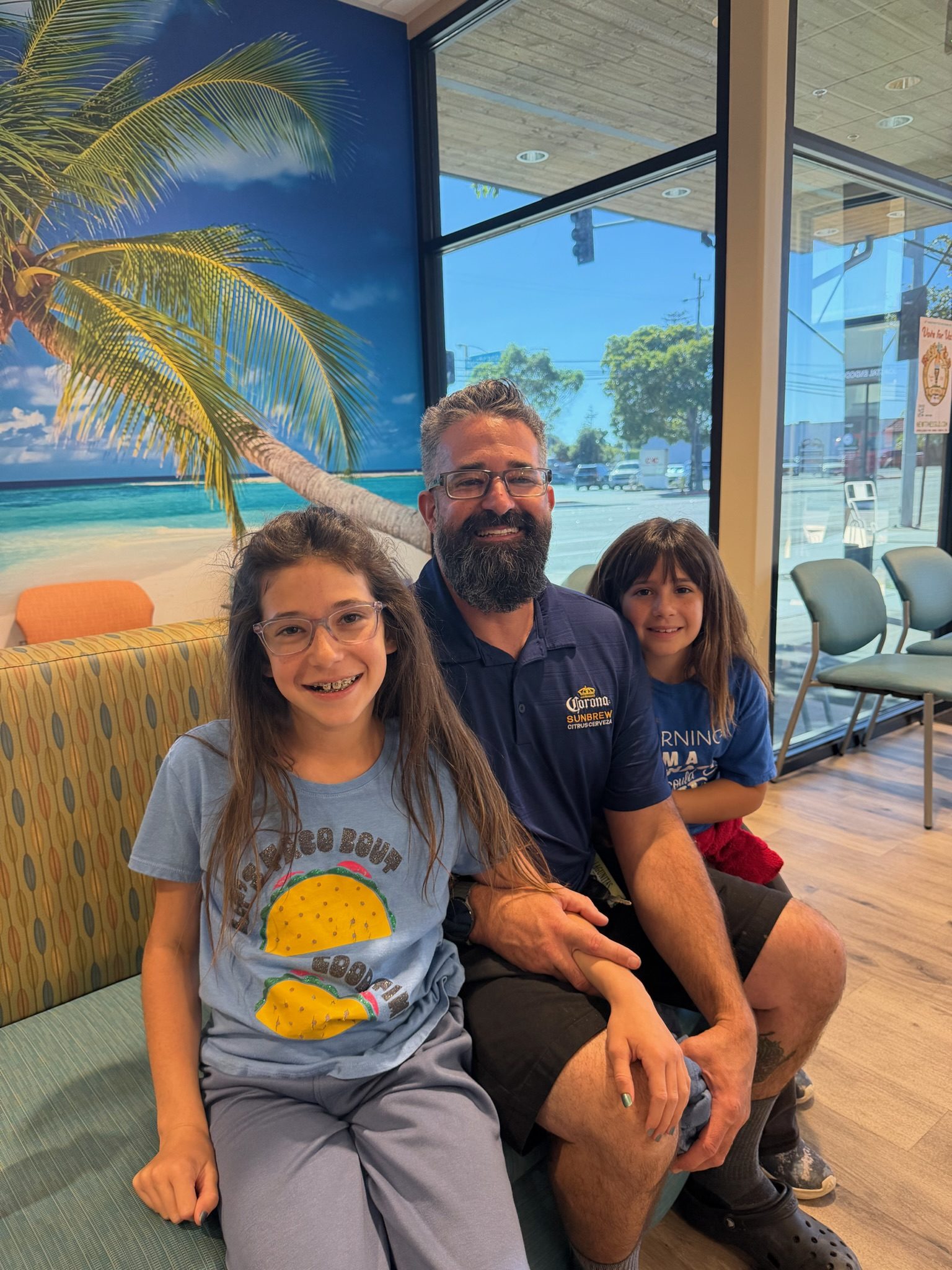 A patient with her parents in the Arroyo Grande waiting area.